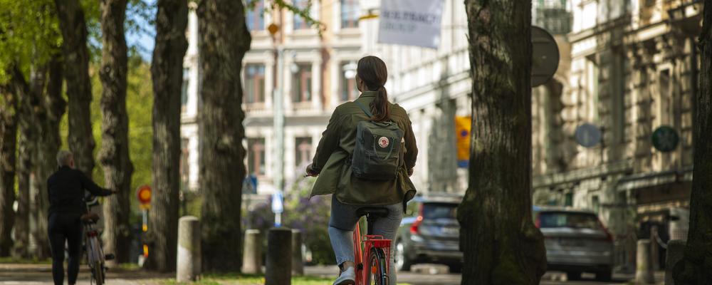 A student cycling in central of Gothenburg.