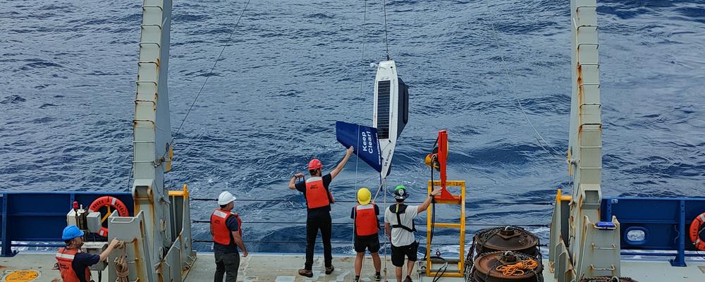 Researchers deploying ocean robots.