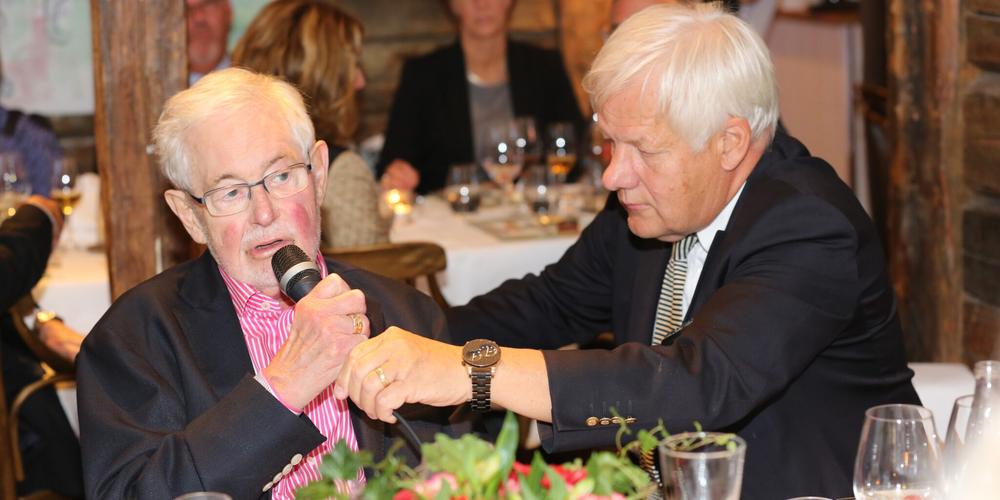 Per-Ingvar Brånemark receives help with the microphone from his colleague and friend Tomas Albrektsson during a dinner party in 