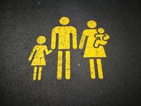 an asphalt drawing of a family of a father, mother and two children