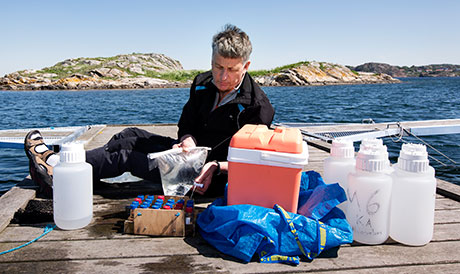 Scientist on jetty with equipment