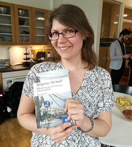 Hanna Leonardsson with her PhD thesis Navigating the Local: Municipal Engagement in Lebanese Local Peacebuiling.