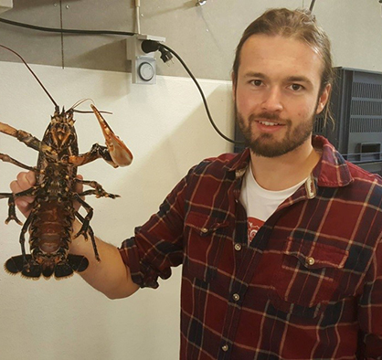 James Hinchcliffe holding a lobster
