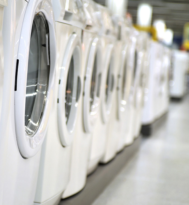 Several washing machines standing in a row.