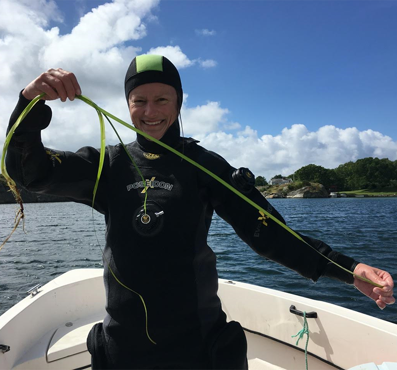 Marlene Jahnke smiling in diving suit during field research