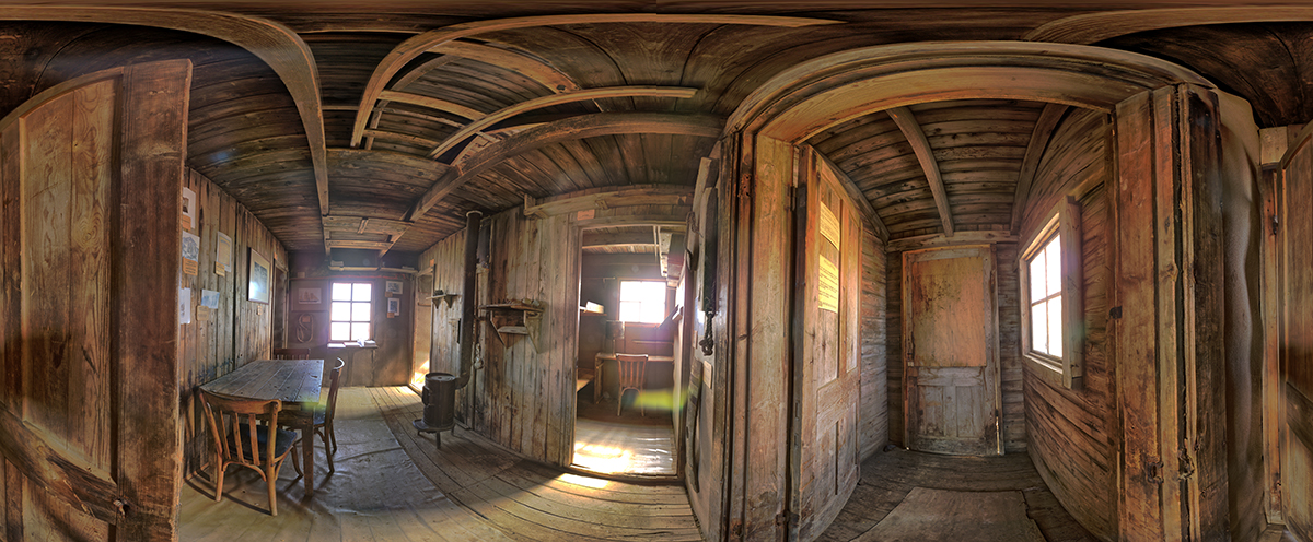 virtuell bild som visar gamla träbeklädda rum och möbler