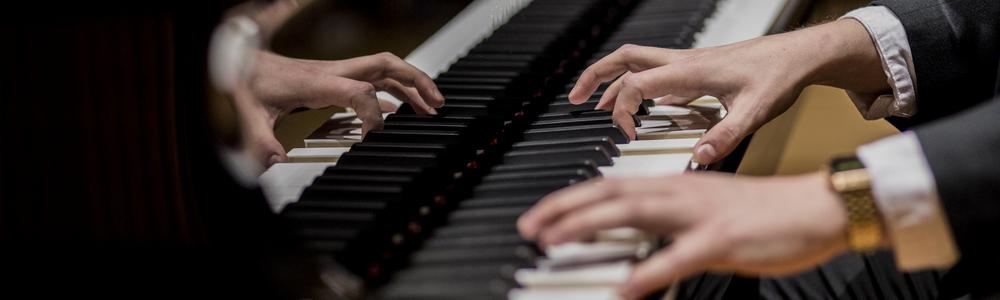 Piano keyboard and hands