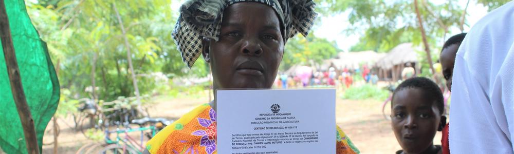 Local woman holding up her certificate