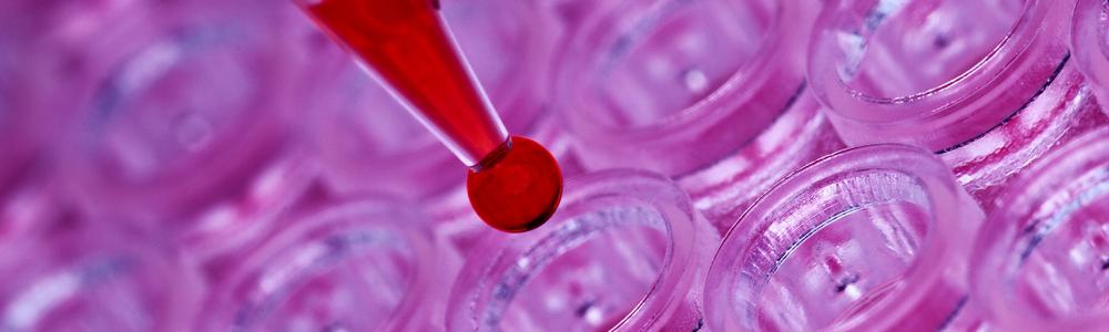 drop of blood over test tubes