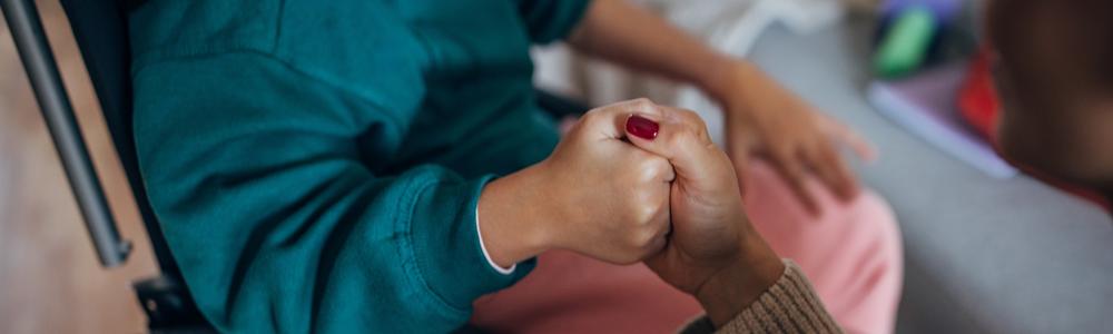 A Mother And Daughter Enjoy A Playful Exercise At Home