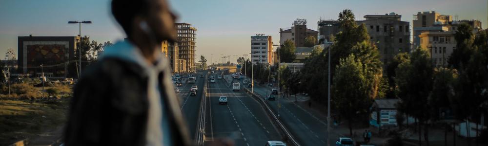 Ethiopian city with a man seen i the foreground