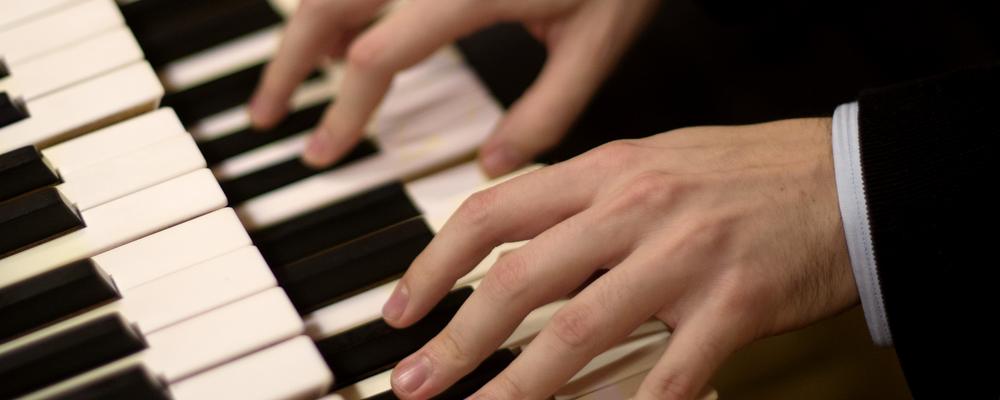 Fingers playing an organ