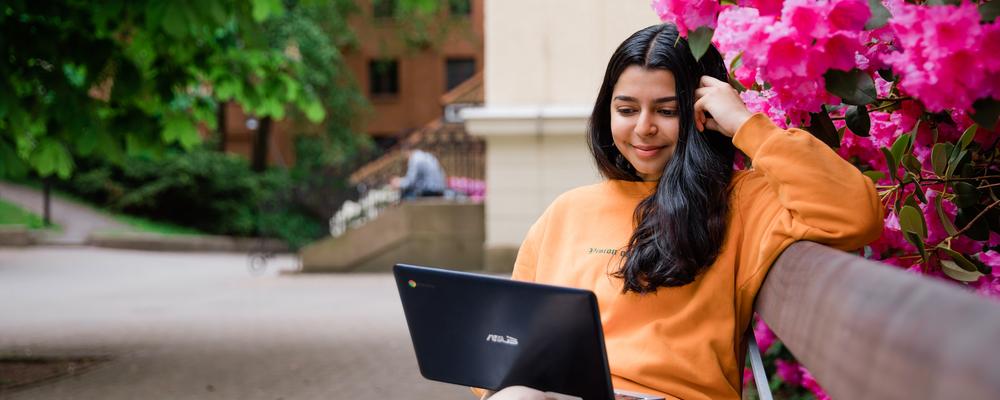 Student sitting with a laptop