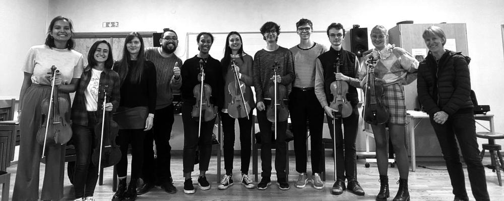 A group of people with violas