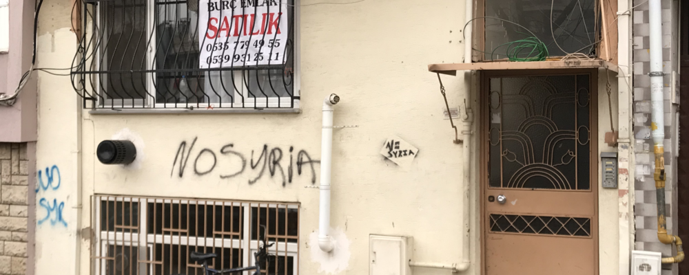 A painting with the text No Syria