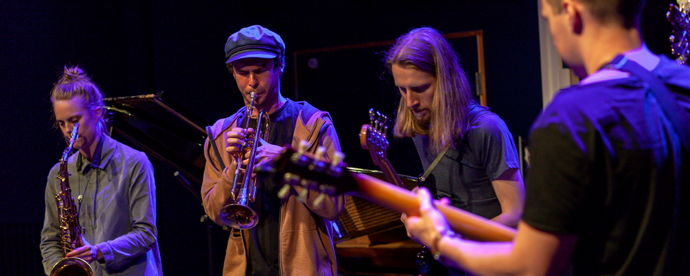 A group of persons with musical instruments