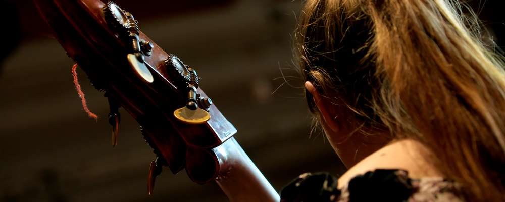 A person with a string instrument