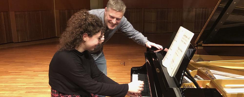 Two persons at the grand piano
