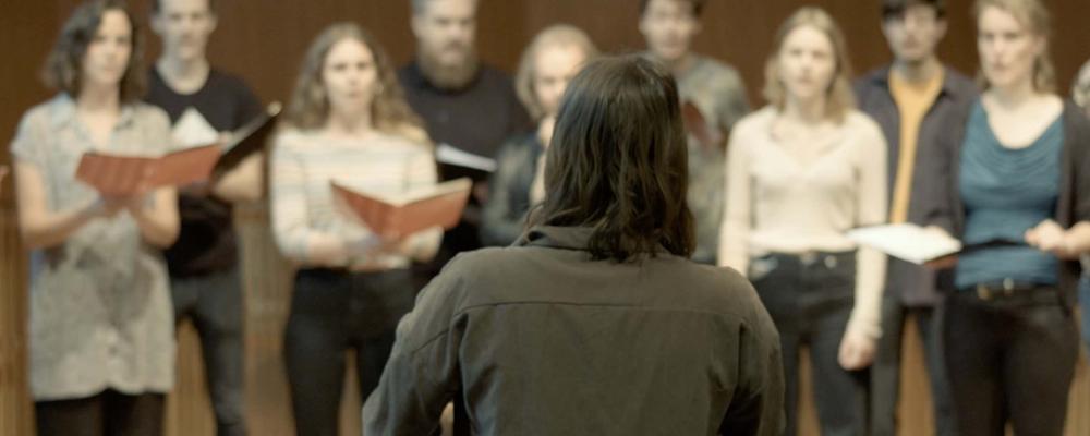 A person conducting a choir