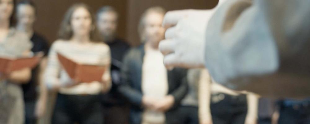 A person conducting a choir