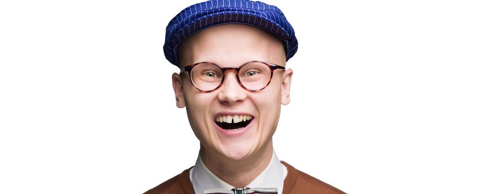 A person wearing glasses and a cap