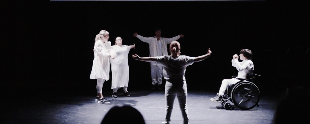 Several persons on a stage