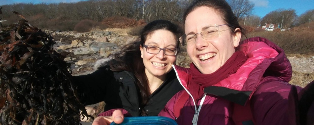 Emma Berdan (left) and collegue Claire Mérot on the beach looking for seaweed flies to be used for studies of supergenes. 