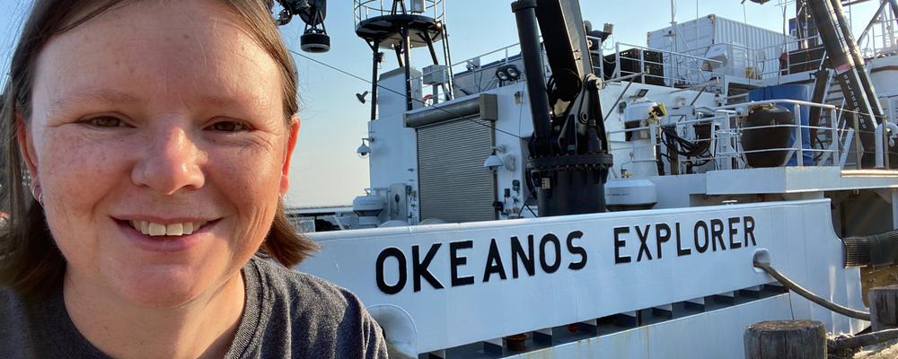 Deep-sea biologist Rhian Waller in front of the research vessel Okeanos Explorer.