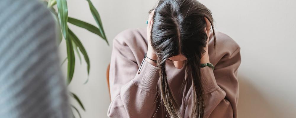 Woman appearing to be overwhelmed