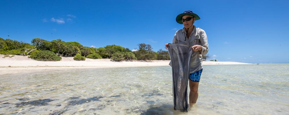 Picture of Cynthia on a sandy beach.