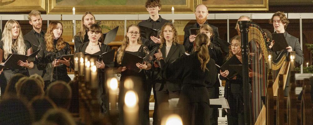 Several persons singing in a church