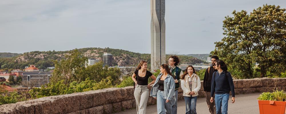 Three students standing outside one of our libraries