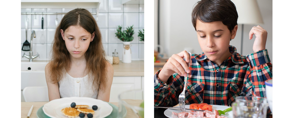 Boy and girl struggling to eat food