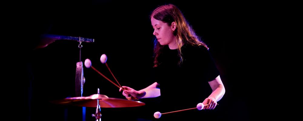 A person playing percussion instruments
