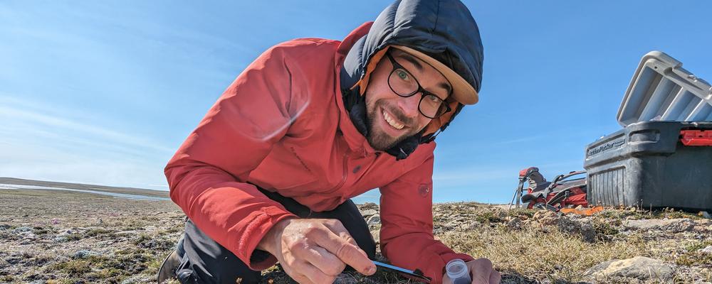 Researcher Jakob Assmann taking soil samples. 