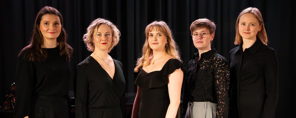 Five persons in a dark room