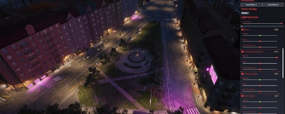 En upplyst stadsmiljö en mörk kväll, sedd uppifrån
