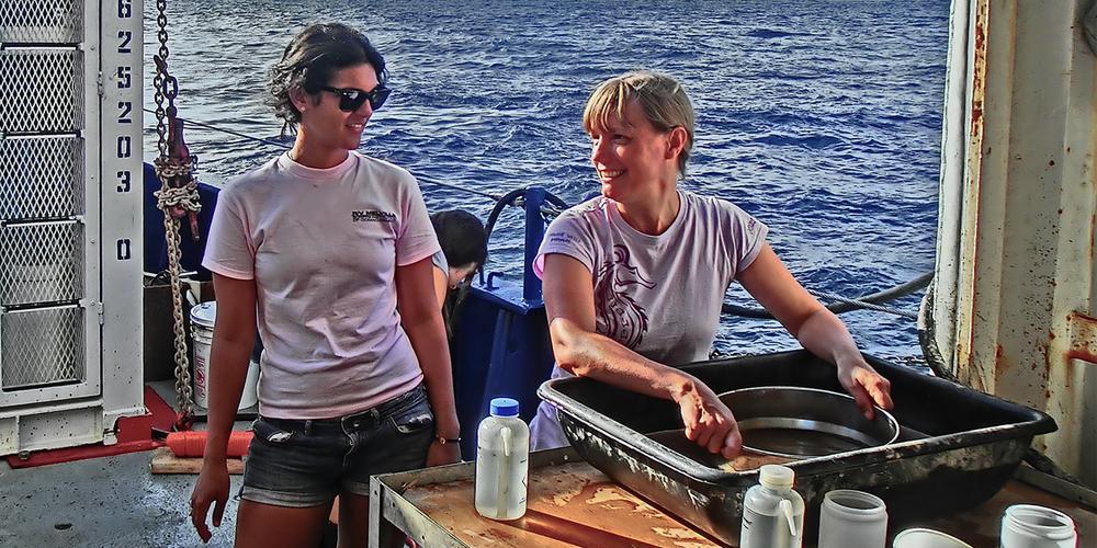 Two women onboard a research ship.