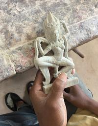A traditional Khmer Apsara dancer carved by one of the artisans trained and employed by the tourism social enterprise Artisans Angkor in Siem Reap, Cambodia