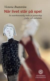 A book cover with two paper figurines