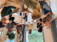 Researchers and students discussing over coffee