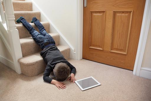 Child falling downstairs with tablet