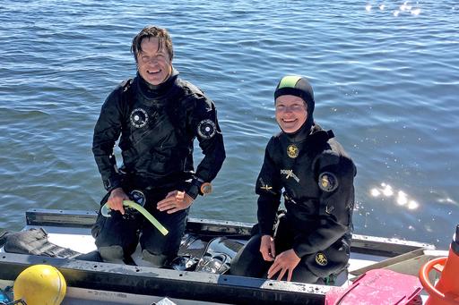 Two researchers in wet suit