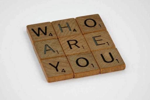 Wooden tiles with the words who are you