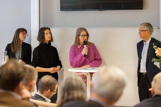 Four people in a panel discussion