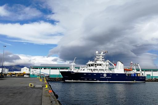 The R/V Skagerak in Reykjavik’s harbour with mountains in the background