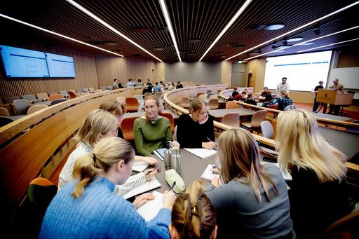 Students sitting in a large lecture hall