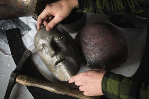 Detail of work with mask in metal