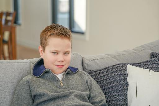 Boy sitting on a sofa