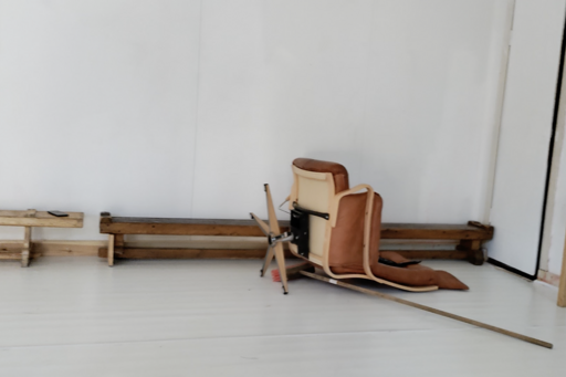 An armchair lies on the floor